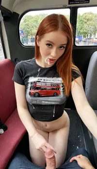 Ultrarealistic. POV. Beautiful 20 year old with long straight auburn hair. She is wearing a cute t-shirt, she is slim, with small but perfect tits covered by the fabric of her t-shirt. On a bus travelling through London with a red London bus and black taxi visible through the window. She is kneeling on the floor with cum on her lips and an 8inch cock in her hand. Cum.