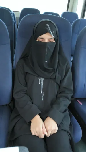 A young Afghan girl, aged 18, was sleeping in a bus when a man ejaculated on her head. She woke up and saw the cum on her face and hair. The man had taken off his niqab to ejaculate,