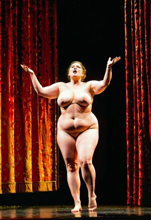 A naked fat singer lady was performing on stage in a lyric opera play with emotion