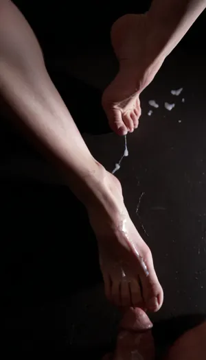 extreme close-up on feet with excessive cum on them, ((excessive thick cum:1.3)), 8k, photorealistic, soft lighting, cinematic dark lighting, an interplay of light and shadow, artsy, work of art, price winning, <lora:dark:.8>