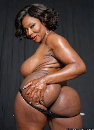 65 years old granny with oversized big breasts caresses herself, perfect curvy body, old gorgeous bimbo, wrinkled face, perfect real grandmother, makeup, exposed pose, ebony, big booty, panties High quality photo, high detailed photo, photo studio