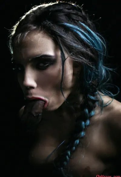 An intimate profile of an intense goth woman with her long ice blue hair cut in a shocking punk braid inspired style including jagged blunt bangs framing her fierce features. She is standing in front of a black background wearing a black velvet under boobs bustier accentuating her slender neckline and defined jaw. Her fine makeup is smokey and sultry with thick winged eyeliner while her black lipstick provides a shark contrast against her pale creamy porcelain skin. Minimalist moody chiaroscuro lighting and a Dutch angle creating a dramatic effect. The overall mood of the image is sensual and alluring, with undertones of anticipation and desire, (black background, chiaroscuro lighting, Dutch angle:1.4), ZipRealism, pov_deepthrt, deepthroating, a, man's, penis, blsdp, <lora:dark:1.1>, <lora:concept_pov_dt_xl2-000020:1.5>