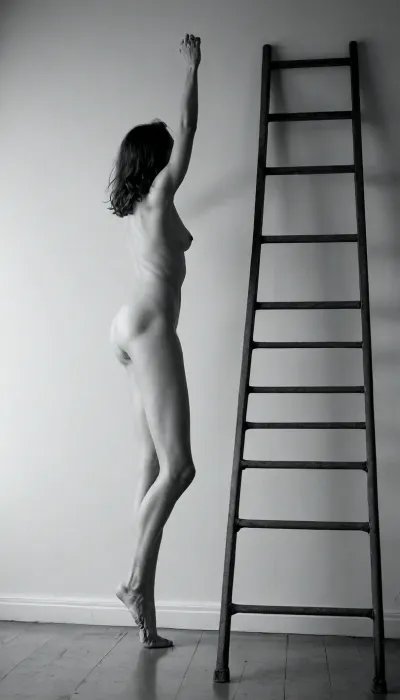 A minimalistic black-and-white nude study of a model arching over an old metal ladder, one foot on highest rung, torso parallel to floor, hard side lighting for bold contrast and graphic shadow patterns, shot with a 50mm lens at f/1.4 for extreme separation of subject, ultra-detailed rendering of skin creases and ladder texture, ––v 5 ––q 2, <lora:Realistic_People_V1:1.1>, BadX