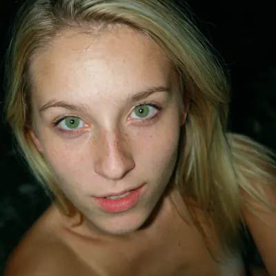 Iphone shot, amateur selfie, gorgeous young girl, long blonde hair, green eyes, freckles everywhere, tight and firm, 18 years old girl, naked, very slim girl, Best quality, realistic, slim waist, small perky fake breasts, proudly presenting her beautiful breasts, Looking at the camera, fresh face, shy look, very petite girl, very detailed, <lora:eGirls_XL_v1:.7>, macro shot, depth of field, soft front light, HDR, (muted colors:1.2), Canon RF 100mm F2.8L Macro IS USM, Kodak Portra 400 color film. Nostalgic, film-grain aesthetic., with an overall underexposure of 1-2 stops to accentuate the darkness and isolation of the environment. Close-up on face. Soft backlight.