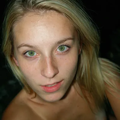 Iphone shot, amateur selfie, gorgeous young girl, long blonde hair, green eyes, freckles everywhere, tight and firm, 18 years old girl, naked, very slim girl, Best quality, realistic, slim waist, small perky fake breasts, proudly presenting her beautiful breasts, Looking at the camera, fresh face, shy look, very petite girl, very detailed, <lora:eGirls_XL_v1:.7>, macro shot, depth of field, soft front light, HDR, (muted colors:1.2), Canon RF 100mm F2.8L Macro IS USM, Kodak Portra 400 color film. Nostalgic, film-grain aesthetic., with an overall underexposure of 1-2 stops to accentuate the darkness and isolation of the environment. Close-up on face. Soft backlight.