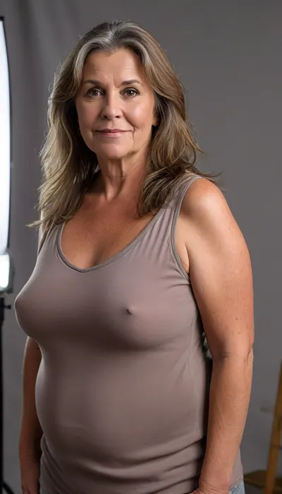 (Brunette ssbbw Gilf:1.4), beautiful 60 year old woman stood in a, (photography studio:1.6), (perfect studio lighting), (obese:1.5), drooping, saggy, (smile:1.3), (full body shot), (detailed skin:1.8), (long brown straight hair with gray highlights:1.3), (big eyes:1.3), (detailed eyes), (chubby face:1.3), wearing a lowcut v-neck sleeveless T-shirt, braless, Wearing, clothes, that, make, sense, with, Braless>, <lora:bralessSDXL_v1_00022:.5>, <lora:MJ52:.2>