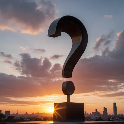 A big steel question mark 10 meters high on a city square in front of a sunset