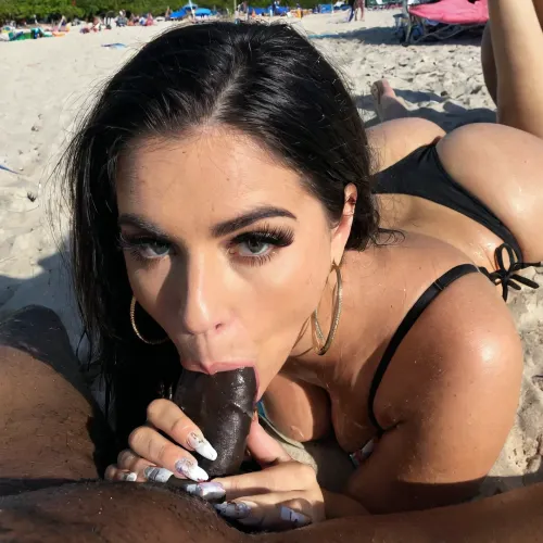 The girl next door was a cute Mexican amateur with big eyes, long thick eyelashes, and dark skin. She had a big black dick in her mouth and was giving a blowjob to a black man's big black dick in public