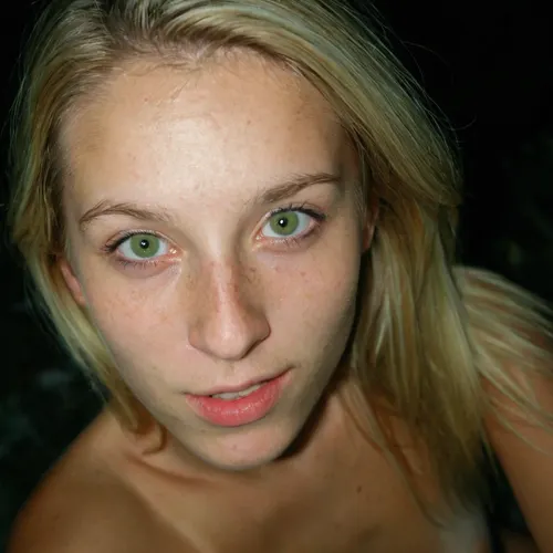 Iphone shot, amateur selfie, gorgeous young girl, long blonde hair, green eyes, freckles everywhere, tight and firm, 18 years old girl, naked, very slim girl, Best quality, realistic, slim waist, small perky fake breasts, proudly presenting her beautiful breasts, Looking at the camera, fresh face, shy look, very petite girl, very detailed, <lora:eGirls_XL_v1:.7>, macro shot, depth of field, soft front light, HDR, (muted colors:1.2), Canon RF 100mm F2.8L Macro IS USM, Kodak Portra 400 color film. Nostalgic, film-grain aesthetic., with an overall underexposure of 1-2 stops to accentuate the darkness and isolation of the environment. Close-up on face. Soft backlight.