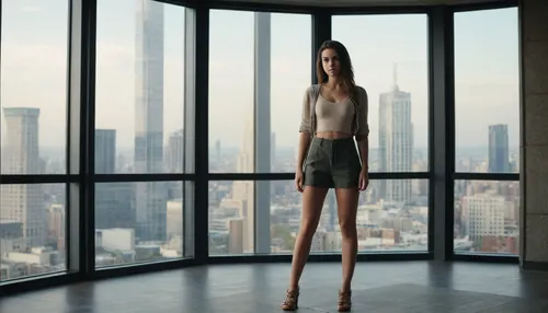 full body view, 20-year-old brunette standing in front of a large window with city outside, professional casting photo studio, studio lights