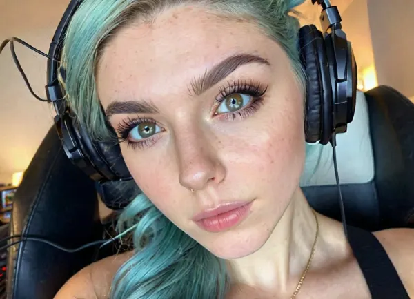 The woman with pixie face, high cheekbones, narrow jawline, and narrow nose is described as having a pixie face with upturned eyebrows and a heart-shaped face. She has pale skin with freckles on her cheeks and