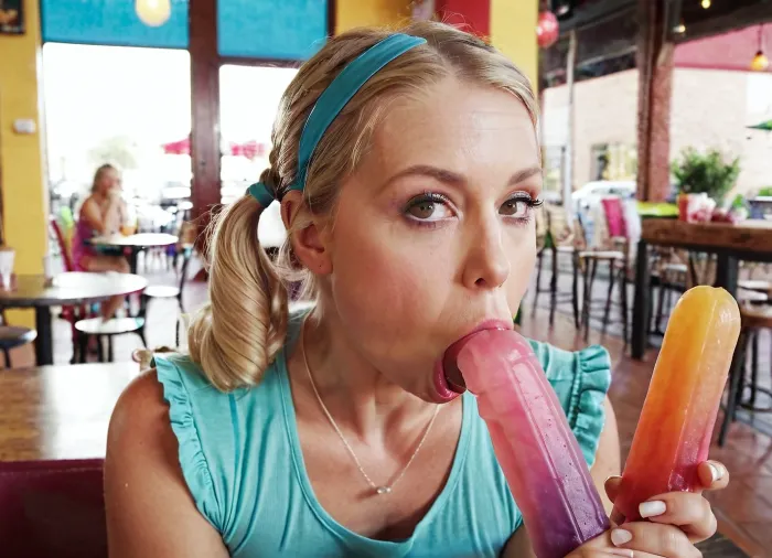 The 42yo woman with a big multi colored popsicles in the cafe was sucking and texting while she sucked, knowing that she would be back for more